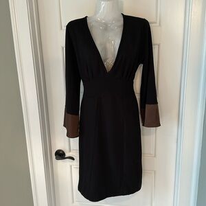 Black knit dress with brown satin trim on sleeves. Size large.